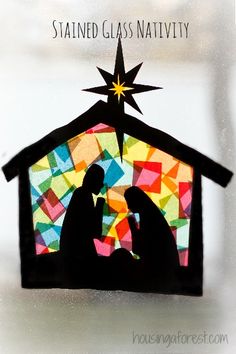 stained glass nativity scene with the birth of jesus and baby jesus in manger