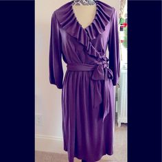 Go From The Office To Dinner In This Tahari Rich Purple Puff Sleeve Surplus Wrap Dress With Pleated Ruffle Collar Machine Wash And Dry 100% Polyester Knit. Gathered Elastic Waist, Extra Long 2” Wide Self Wrap Belt With Belt Loops. Fit Size 4 To8. Dress Form Measurements 33 24 36. Great Packable Item. No Damage New With Tags Non-Smoker No Pets. Same Day Shipping Elegant V-neck Ruffle Dress For Fall, Elegant Flowy Ruffle Dress For Fall, Elegant Flowy Ruched Ruffle Dress, Fitted Purple Ruffle Dress With Ruffle Hem, Elegant Purple Midi Dress With Ruffles, Elegant Purple Ruffle Dress, Gold Elegant Dress, Purple And Black Dress, Barbie Pink Dress