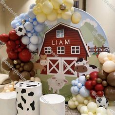 balloons and farm animals are on display in front of a sign that says i am