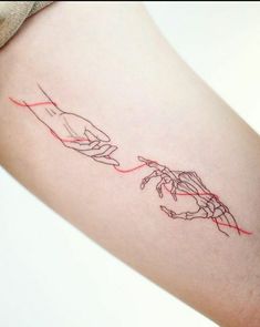 a woman's arm with two hands drawn on it