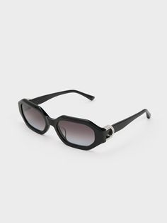 Elevate your style with the Gabine oval sunglasses, boasting a distinctive geometric-shaped design in sleek all-black. These sunglasses serve as the perfect foundation to complete any look with impeccable style. Whether you are aiming for a cool-girl or street-chic aesthetic, these sunglasses will provide the perfect finishing touch. The Gabine accents on the side are embellished with dazzling Swarovski crystals, which effortlessly sparkle and will make you stand out wherever you go. Perfect Foundation, Charles Keith, Oval Sunglasses, Sunglasses & Glasses, Street Chic, Elevate Your Style, Swarovski Crystal, All Black, Cool Girl