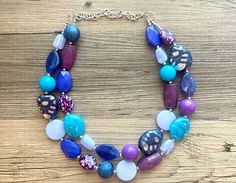 💞One of a kind & ready to ship💞 Dress up any outfit - great for a night out or with a white tee! 17 Inch Necklace with a 4 inch silver extender chain and silver lobster clasp. This is an eclectic bunch of acrylic beads in shades of blue and purple 😍 A total conversion starter! Thank you for supporting American small business! *Smoke and pet free home!* I ship 6 days a week! This particular necklace one of a kind and is READY TO SHIP! Thank you for browsing my store! Blue Adjustable Bib Necklace With Round Beads, Adjustable Blue Bib Necklace With Round Beads, Adjustable Blue Bib Necklace For Party, Blue Beaded Bib Necklace For Party, Blue Large Beads Necklace, Adjustable Blue Bib Necklace With Colorful Beads, Blue Costume Jewelry Necklace With Large Beads, Party Necklaces With Colorful Blue Beads, Blue Necklaces With Colorful Beads For Party