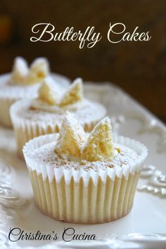 three cupcakes with powdered sugar on them are sitting on a white plate