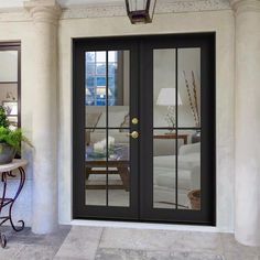 the front door to a house with glass doors