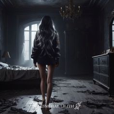 a woman is walking through a dark room