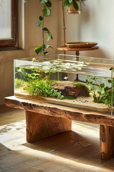 a fish tank sitting on top of a wooden bench