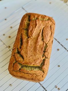 a loaf of bread sitting on top of a cooling rack