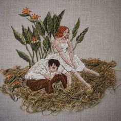 two people sitting on top of a pile of hay next to plants and flowers in the grass