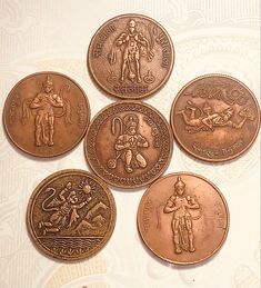 five different types of coins sitting on top of each other