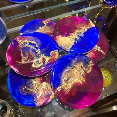 blue and purple plates with gold designs on them