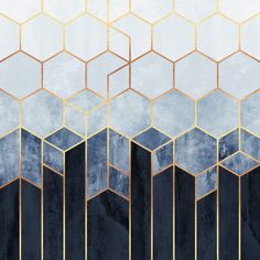 an abstract painting with gold and blue hexagons on the sides, framed in black