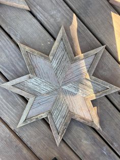 an old wooden star on the side of a building