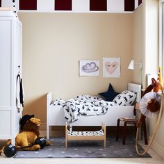 a child's bedroom with toys on the floor