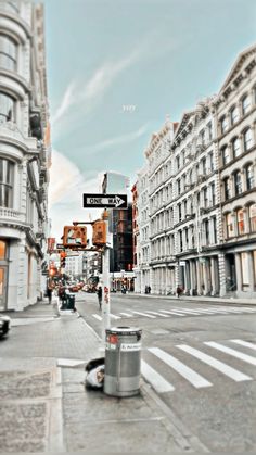 a street sign on the corner of a city street