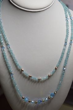 "DESCRIPTION: Stunning 2-strand aquamarine, swarovski and sterling silver bead necklace.  March birthstone. Approximate length:  19 and 22\" Article       1055026 Color       blue and silver Material       Stone & crystal Size         Shape        Quantity1 Origin      Unknown  - SHIPPING: I ship quickly but holidays and Sunday prevent next day mailing so please if you place an order on those days allow me an extra day to get your items in the mail. All items I ship are either in puff pad envelopes or gift boxed to prevent damage to the item. SUGGESTIONS: I welcome any comments, questions or suggestions. I am always looking to improve my store and assist my guests any way I can. OTHER SHOP(S): You can see my vintage and ready to wear finished jewelry at: https://www.etsy.com/shop/Reflectio Cheap Silver Double Strand Beaded Necklace, Luxury Double Strand Faceted Beaded Necklaces, Aquamarine Faceted Beads Jewelry, Crystal Bead Necklace, Silver Bead Necklace, Glass Beads Jewelry, Beaded Cross, Swarovski Crystal Beads, Aqua Marine