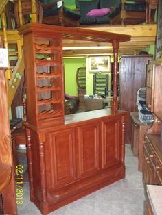 a kitchen with wooden cabinets and stairs