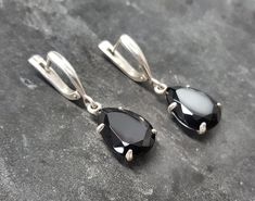 Onyx Earrings set with Natural Onyx in a top grade, diamond cut & stunning black color, at 16x12mm, weighting 20 Carats for a pair. Black Teardrop Earrings design made of Solid 925 Sterling Silver ☞ made to last Matching Ring: www.etsy.com/listing/693691499 Matching Pendant - please ask me December Birthstone - Genuine & Natural Stone ❀  ⌛ Last pair left ⌛    For Pierced Ears - has a pin that goes into the ear and a leaver that securely closes on the pin behind the earlobes - "English Lock" ❀ Ea Earrings Design, Matching Ring, Real Jewelry, Onyx Earrings, 925 Silver Earrings, Matching Rings, Dangling Earrings, Earrings Long, Black Earrings