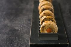 an assortment of pastries on a black plate