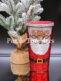 a christmas decoration with a santa claus boot and pine branches in front of a burluck bag