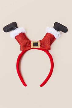 a red headband with santa claus's hat on top and ears attached to it