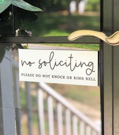 a sign that says no solicing please do not knock or ring bell on the front door