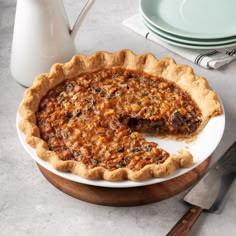 a pie sitting on top of a white plate