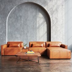 a living room with two couches, a coffee table and an arch in the wall