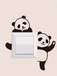 two pandas are sitting on top of a light switch cover, one is holding the other