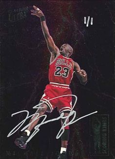 an autographed photo of a basketball player jumping in the air with his arms outstretched