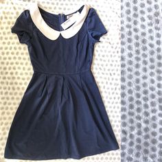 Blue Mini Dress With White Collar And Zip On Back. Nice For Work Or Party. Size Medium. Purchased From Modcloth Fitted Party Dress With Peter Pan Collar, Fitted Dresses With Peter Pan Collar, Chic Fitted Mini Dress With Peter Pan Collar, Cotton Fitted Dress With Peter Pan Collar, Elegant Navy Cotton Dress, Navy Casual Dress For Party, Cute Fitted Navy Dress, Navy Fitted Cute Dress, Navy A-line Cotton Dress