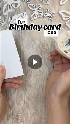 someone is making a birthday card out of paper