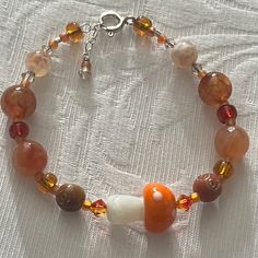 Have You Been To The Mushroom Festival? Adorable Orange Glass Mushroom Focal Bead Bracelet Swarovski Crystals Orange Glass Mushroom Bead Natural Stone Sterling Silver Adjustable Closure Nwt All Pieces Created By Hand At The Studio. . Smoke And Pet Free Happy To Answer Any Questions. Fall Theme Bracelets, Fall Bead Jewelry, Natural Stone Bracelet Ideas, Mushroom Bracelet Pattern, Cute Bead Bracelet, Earthy Bracelets, Cottagecore Bracelet, Fall Bracelets, Glass Beads Bracelet