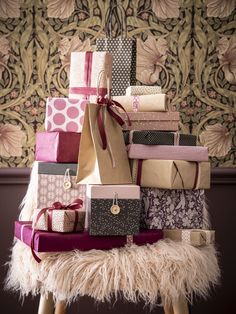 a pile of presents sitting on top of a stool