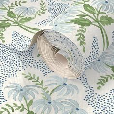 a roll of blue and green floral wallpaper