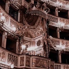 an ornately decorated building with chandeliers and lights