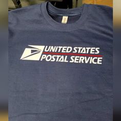 Postal Crewneck Long Sleeves On The Front Of Long Sleeve United States Postal Service Logo And On The Back The New Eagle. Long Sleeve Shirt Colors Available: Navy, Black, Light Gray, Purple, Dark Gray, White With Blue Design. Navy Cotton Tops With Letter Print, Navy Cotton Shirt With Letter Print, Navy Crew Neck Top With Letter Print, Navy Cotton Top With Letter Print, Navy Cotton Tops With Logo Print, Postal Service Logo, Blue Long Sleeve T-shirt With Embroidered Graphics, Navy Cotton Pre-shrunk Shirt, Blue Long Sleeve T-shirt With Embroidered Logo