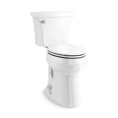 a white toilet sitting on top of a white floor