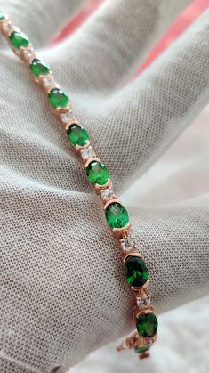 💕💕 TENNIS BRACELET 💕💕 👇 METAL INFORMATION 👇 💕MATERIAL TYPE  - 14K SOLID ROSE GOLD / 925 STERLING SILVER 👇 SIDE GEMSTONE INFORMATION 💕GEMSTONE-  NATURAL TSAVORITE  💕GEMSTONE SHAPE- OVAL  💕GEMSTONE COLOR -  GREEN  💕GEMSTONE SIZE -  7 X 5 mm 💕GEMSTONE WEIGHT - 7.5 CARAT 👇💎 𝐒𝐈𝐃𝐄 ACCENTS 𝐃𝐄𝐓𝐀𝐈𝐋𝐒:👇 💕ACCENTS - WHITE TOPAZ  💕WHITE TOPAZ  SHAPE - ROUND 💕WHITE TOPAZ  CUT - BRILLIANT 💕DIAMOND COLOR - WHITE 💕DIAMOND SIZE - 2 MM 💕DIAMOND QUANTITY - 8 PC 💕DIAMOND WIGHT - 0.40 Green Oval Tennis Bracelet As Gift, Round Emerald Tennis Bracelet As Gift, Elegant Green Tennis Bracelet As A Gift, Elegant Green Tennis Bracelet As Gift, Elegant Green Tennis Bracelet Gift, Classic Green Bracelets For Gifts, Green Oval Tennis Bracelet For Gift, Emerald Tennis Bracelet Gift, Round Emerald Tennis Bracelet Gift