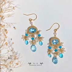 ♢ FEATURES & MATERIALS ~Topaz:natural colour,8*10mm,6*10mm,7ct*2 ~Pearl:natural colour, 2-3.5mm ~Apatite: natural colour,2-4mm，4*6mm ~Materials: 14K gold filled Topaz is November gemstone. I can't wait to recommend these gorgeous earrings to you, they are my favorite gemstone earrings! I used 14ct high quality sky bule topaz and paired them with apatite and pearl mini beads, they sparkled in the sunlight and were so charming!It is suitable for weddings, parties and banquet. All metals are filled Luxury Topaz Earrings For Wedding, Luxury Handmade Chandelier Earrings For Weddings, Blue Briolette Earrings For Wedding, Handmade Topaz Jewelry For Wedding, Handmade Elegant Aquamarine Earrings, November Gemstone, Boho Chandelier, Gemstone Wedding, Swirl Earrings