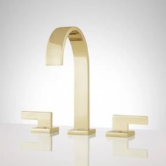 the modern faucet is made out of brass and features two square shaped handles