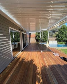 a wooden deck with an awning over it