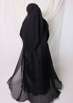 LEYLAH abaya set comes with ⁃ Long-sleeved chiffon maxi dress ⁃ Abaya in organza with seamed bodice ⁃ Chiffong hijab that is 70x170cm Color: Black Chiffon Maxi Abaya For Wedding, Floor-length Chiffon Abaya For Wedding, Wedding Chiffon Abaya Maxi Length, Floor-length Georgette Abaya For Party, Eid Chiffon Maxi Abaya, Silk Maxi Length Abaya, Long Chiffon Abaya For Parties, Formal Long Abaya, Elegant Floor-length Chiffon Abaya