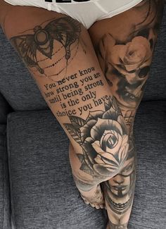 a woman's legs with tattoos and words on the bottom part of her leg