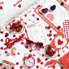 valentine's day items laid out on a table with red and white polka dots