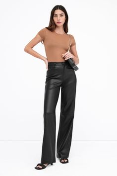 A force of nature in stretchy faux leather with a high-sheen finish, our Julien Pants offer a luxurious feel and an illuminating dimension to any look. Thoughtfully constructed for seasonless wear, she features a wide-leg, high-rise cut and a distinctive horizontal seam at the knees. Julien is designed to evoke a surge of confidence wherever and whenever you wear her. Also available in latte. | Rocio is 5'9.5" (175 cm) tall, wearing size XS. Total length from below the waist is approximately 42. Force Of Nature, Tunic Hoodie, Sweatshirt Fabric, A Force, The A Team, Women Supporting Women, Petite Size, First Look, Black Pants