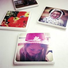 four polaroids are arranged on a table with one girl wearing a pink hat