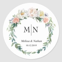 a round wedding sticker with flowers and leaves on the front, which reads mmn