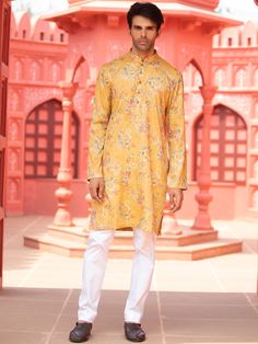 This yellow floral cotton print kurta will instantly give an elegant look.  Made from cotton fabric, this yellow kurta with floral print has front buttons fastening, and a mandarin collar. It is paired with a white cotton stretch churidar pants. An ideal outfit for traditional & special events.

Size Chart For Men





	
	
					Men's Size Chart
		

		
		
						
				Size Chart For Men
				Custom Size Measurement Guide
			
			
				
				
				Custom Size Measurement Guide
1. Take your measurements a Printed Straight Kurta For Spring, Spring Printed Straight Kurta, Yellow Printed Long Sleeve Kurta, Yellow Printed Long-sleeve Kurta, Yellow Kurta With Printed Motifs For Diwali, Spring Cotton Kurta With Floral Print, Traditional Spring Yellow Kurta, Yellow Cotton Kurta With Printed Motifs, Yellow Printed Cotton Kurta