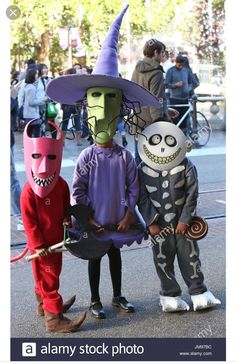 three children dressed up in halloween costumes