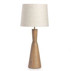 a wooden table lamp with a white shade